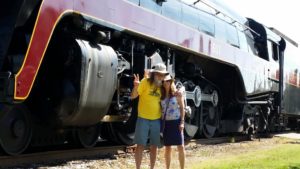 Artist Ray Pague and wife Linda Pace with 611 train
