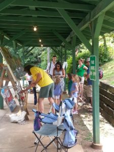 Ray Pague paints the 611 at the historic Saluda Depot, Saluda, North Carolina